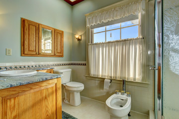 Light tone bathroom with bidet