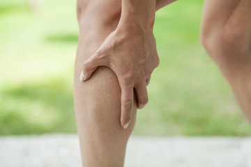 cramp in leg calf during sports activity - obrazy, fototapety, plakaty