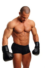 Muscular man with boxer gloves on his hands