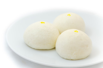 Three Chinese steamed buns isolated on white background
