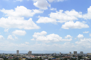 blue sky with clouds and city
