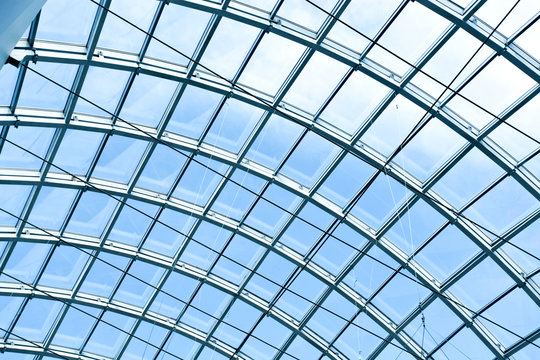 Modern building with curving roof and glass steel column