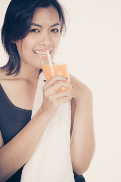 young woman with orange juice, isolated on white background
