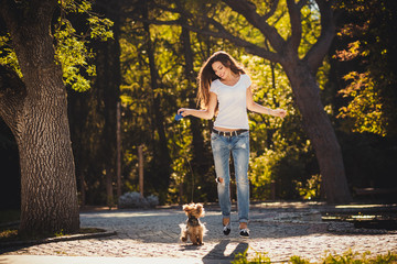 Fototapeta premium Woman beautiful young happy with long dark hair holding small do