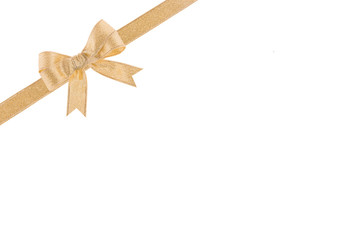 Golden ribbon with a bow on white background