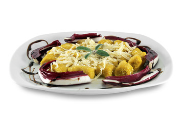 Potato dumplings garnished with radicchio and sage