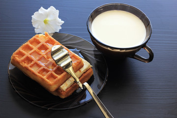 Milk, honey, waffles for breakfast