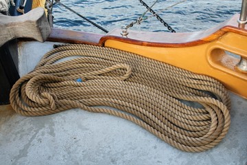 Coiled ropes on the deck of a sailing ship