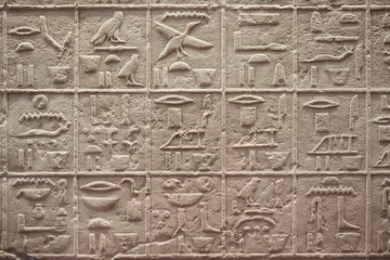 Fotobehang Egyptian hieroglyphics writing on stone background © andersphoto