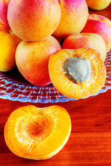 Naklejka na ściany i meble Apricots on wooden table