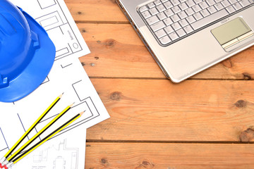 Fototapeta premium Helmet and tools for construction drawings