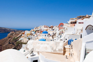 Oia with typical painted houses on the island of Santorini.