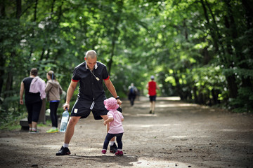 Small girl tries to pass by her father and escape