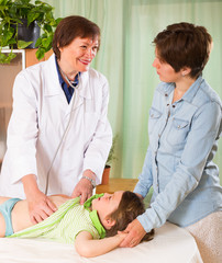 Fototapeta premium Doctor examining child