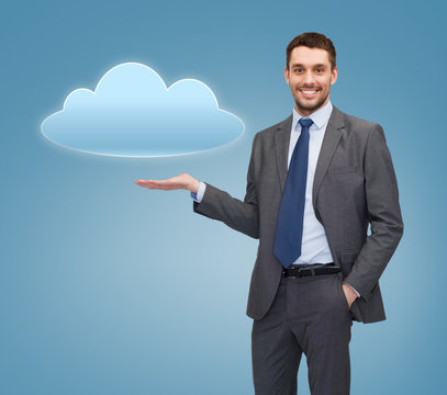 smiling businessman holding cloud icon