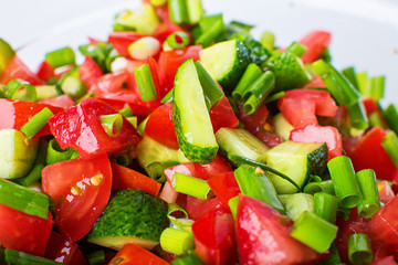 vegetable salad with fresh tomatoes cucumbers and green onions