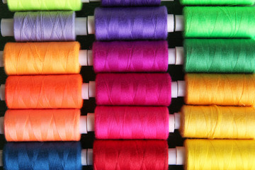 Multicolor sewing threads background