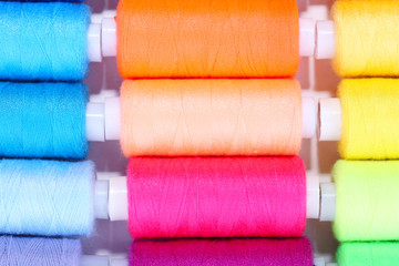 Multicolor sewing threads background