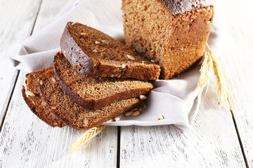 Fresh bread on wooden table, close up