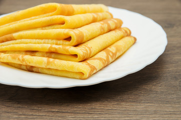 Pancakes on a white plate