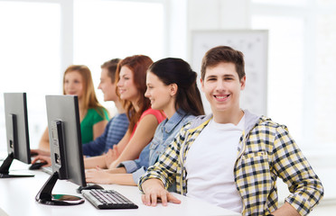 Fototapeta premium male student with classmates in computer class