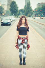 young beautiful hipster woman with red curly hair