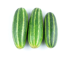 Healthy food. The green cucumbers isolated on white background