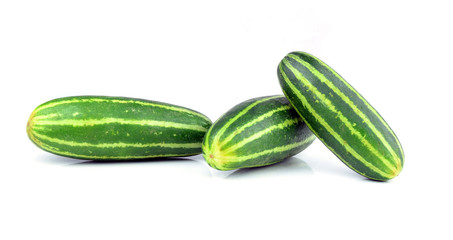 Healthy food. The green cucumbers isolated on white background