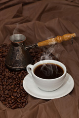 Coffee cup and beans. Selective focus.