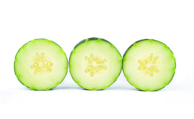 Cucumber and slices isolated over white background