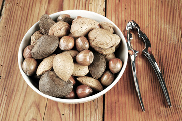 brazil nuts, walnuts, almonds and hazelnuts  in  ceramic bowl