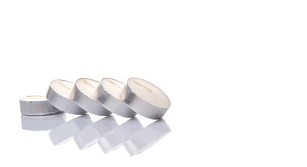 Small tealights over white background