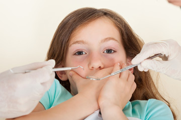 Scared Girl Covering Mouth Before Dental Treatment