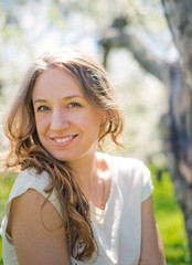 Young woman outdoors portrait. Soft sunny colors.