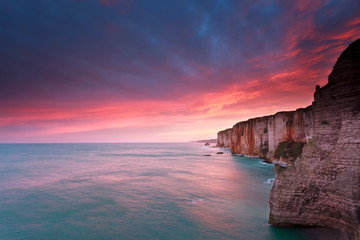 fire sunrise over cliffs in Atlantic ocean