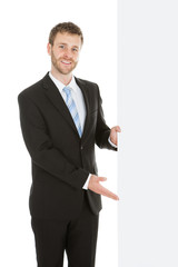 Confident Businessman Showing Billboard