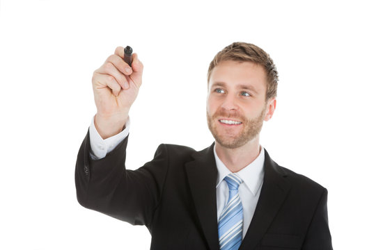 Businessman Writing On Invisible Screen With Marker