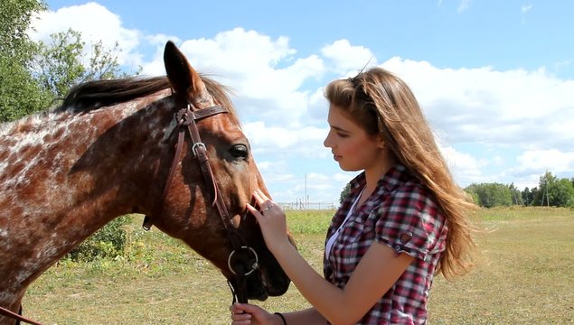 Young woman with horse