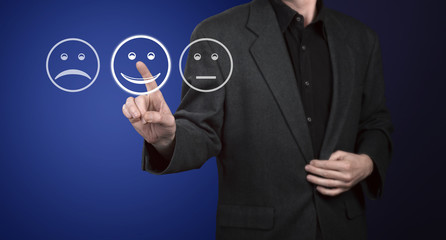 Businessman touching screen with customer service evaluation for