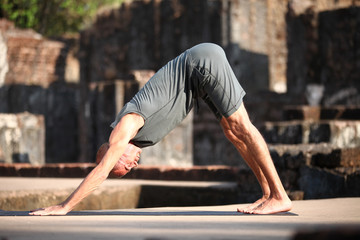 Beautiful yoga position at the ruins of India.