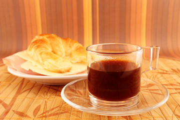 Breakfast with coffee and croissant