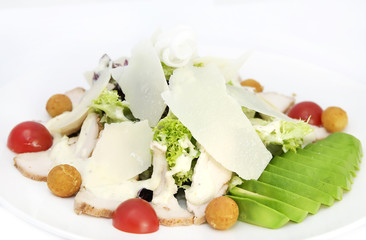 salad with vegetables, meat and cheese on white background