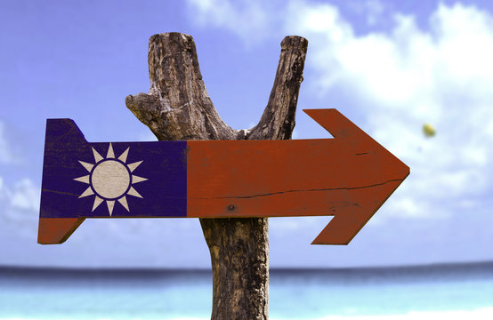 Taiwan wooden sign with a beach on background