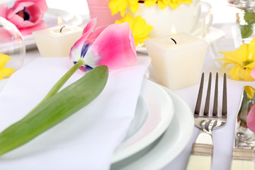 Table setting with spring flowers close up