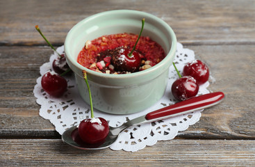 Tasty cherry dessert on table