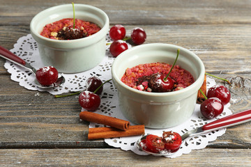 Tasty cherry dessert on table