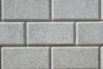 Wall covered with grey polished granite tiles