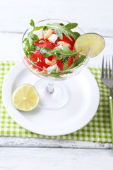 Salad with watermelon, feta, arugula shrimps, balsamic sauce in