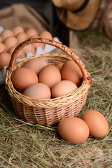 Eggs in wicker basket on table close-up