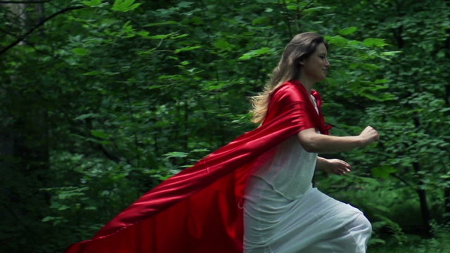 Woman in red cape run in forest, super slow motion, 240fps